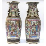 A pair of early 20th Century Chinese earthenware famille rose large baluster vases (2) Further