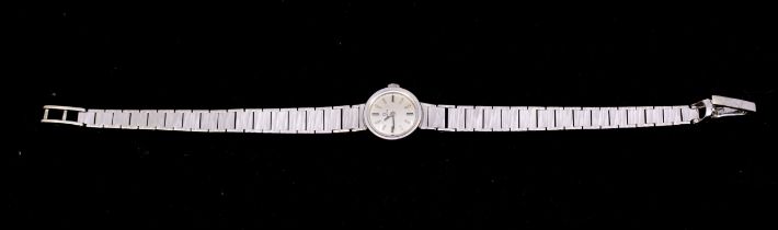Omega: a Ladies vintage 9ct white gold wristwatch, comprising a round silvered signed dial with