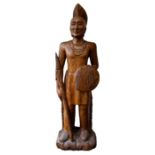 An early to mid 20th Century carved American oak figure of a Native American Mohican Indian warrior,