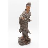 An earthenware model of Guanyin, approx 31cm high