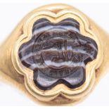 An early 19th century hardstone gold seal signet ring, comprising a six petaled flower motif of