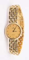 Omega: a Ladies Omega De Ville 18ct gold wristwatch, comprising a round signed gold tone dial with
