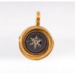 A Victorian garnet and diamond gold set pendant/brooch, comprising a round cabochon garnet approx