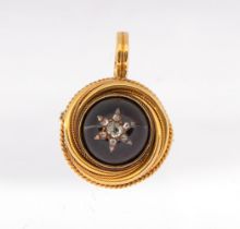 A Victorian garnet and diamond gold set pendant/brooch, comprising a round cabochon garnet approx