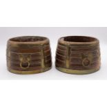 A pair of circular late 19th/early 20th century Tibetan wooden grain measures, with brass