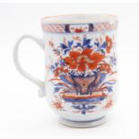 A Chinese porcelain Imari pattern large baluster mug, Qing Dynasty circa 1720-30, painted with a