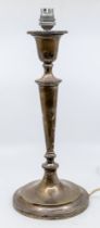An Edwardian silver table lamp, urn shaped socle above tapering stem on circular base, hallmarked by