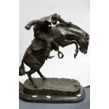 After Frederic Remington (American, 1861-1909) The Broncho Buster (Cowboy) bronze, inscribed, approx