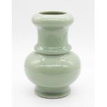 A Chinese celadon glazed porcelain baluster vase, 20th century, with seal mark of the Qianlong