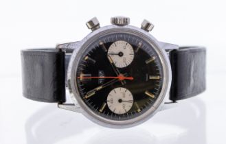 Heuer: a Gentleman's 1960's Reverse Panda wristwatch, comprising a round black dial with baton
