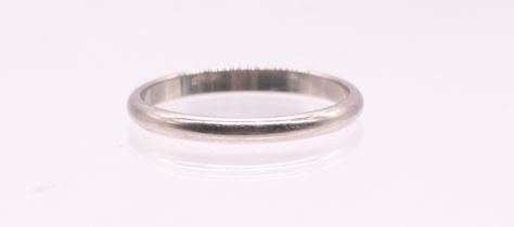 Cartier: a narrow 'D' section platinum band, inscribed to interior 'Cartier pt950 57 QD7771, width