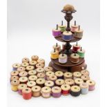 Sewing Interest: a Victorian mahogany two tier reel stand, the turned socle base with seven pegs,