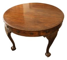 A 19th Century mahogany circular library / drum table, acanthus border above eight drawers (four