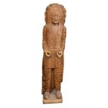 An early to mid 20th Century carved American oak figure of a Native American Red Indian chief, 160cm