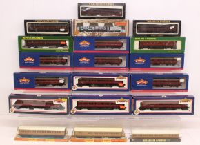OO Gauge: A collection of nineteen boxed OO Gauge coaches and rolling stock to comprise: Bachmann,