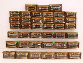 Mainline: A collection of over 30 boxed Mainline, OO Gauge rolling stock wagons of varying livery