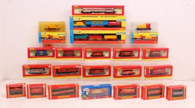 Hornby: A collection of approximately twenty boxed Hornby, OO Gauge rolling stock and coaches. Boxes