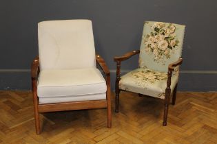 A 1960's teak framed lounge chair, together with an early 20th century low oak frame armchair (2)