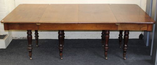 An early 19th century mahogany dining table, the rectangular top with two inset leaves ( later