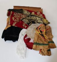 A small collection of early 20th century costume, including a gilt thread embroidered red plush