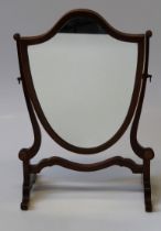 An Edwardian toilet mirror with shield shaped plate. 56 x 38cm