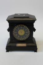 A late Victorian polished slate mantel clock of large size, having a two train movement striking