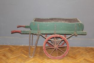 An Edwardian painted street vendors barrow/handcart, raised on iron spoked and iron clad wheels,