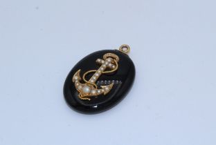 A Victorian onyx and seed pearl mourning locket, with vacant locket. Measures approximately  45 x