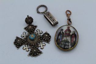 A ceramic Russian orthodox Devotional pendant featuring the Virgin and child and other icons, in a