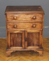 A 19th century mahogany night cupboard, fitted two drawers over a pair of doors, on bracket feet, 79