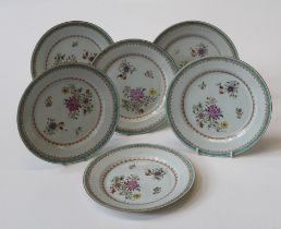 A set of six 19th century Chinese famille rose 23cm diameter plates, each delicately polychrome