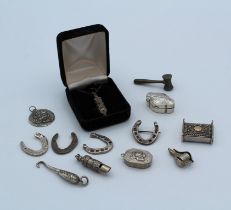 A collection of antique and later silver and other items featuring a small vinaigrette, hallmarked