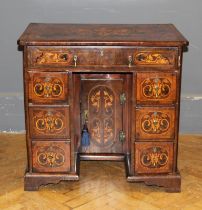 A George III framed walnut, crossbanded, parquetry inlaid and strung twin pedestal kneehole desk.