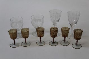 A set of six early 20th century Venetian liquor glasses, each with combed gilded bowl, candy twist