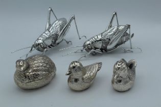 A pair of 20th century white metal cicada, 16cm, together with three white metal bird form