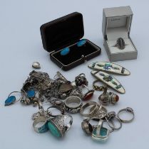 A collection of silver and white metal jewellery. To include sixteen silver / 925 rings, a pair of