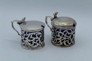 A Victorian silver lidded mustard, with pierced thumb piece and body, London 1841, together with
