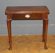 A George III mahogany supper table, rectangular folding top over frieze drawer, raised on cabriole