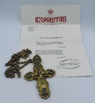 A 19th century Russian orthodox silver gild Bishops cross set with green, red and white pastes, with
