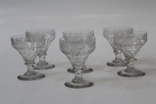 A good set of six early 20th century wine glasses, each with fruiting vine etched and facet cut