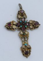 A yellow metal cross featuring, pierced and set with turquoise and amethyst coloured stones, 7 x 5cm