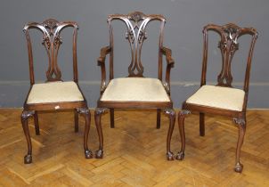 An Edwardian salon open armchair with pierced waisted splat, drop in seat on cabriole forelegs,