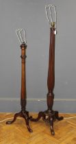 Two mahogany standard lamp bases, one with reeded column, together with another, converted from a