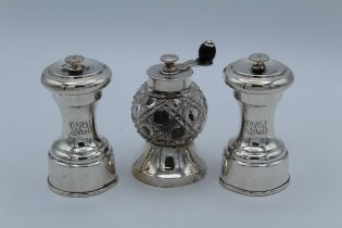 Goldsmiths and Silversmiths Company, a pair of silver pepper grinders, each with engraved