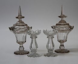 A pair of 19th century lead crystal pedestal bowls and covers, each with spike finial on lobed foot,