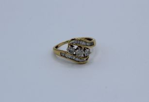 A diamond crossover dress ring featuring an estimated total diamond weight of 1.09 ct. A central