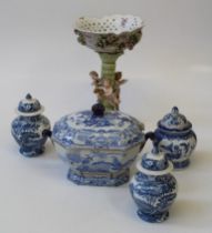 A large, early 20th century German porcelain table centre with pierced floral basket and amorini