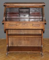 An early 20th century oak tambour front roll top desk of small proportions, 101 x 76 x 45cm