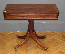 A William IV mahogany supper table, rectangular swivel folding top, reeded column, downswept legs