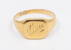 An 18ct gents signet ring, comprising a cushion shaped top, engraved to top, inscription to